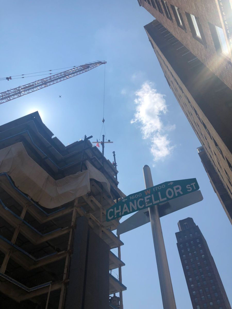 Raising of the beam above the Hyatt Centric hotel at 17th & Chancellor Streets