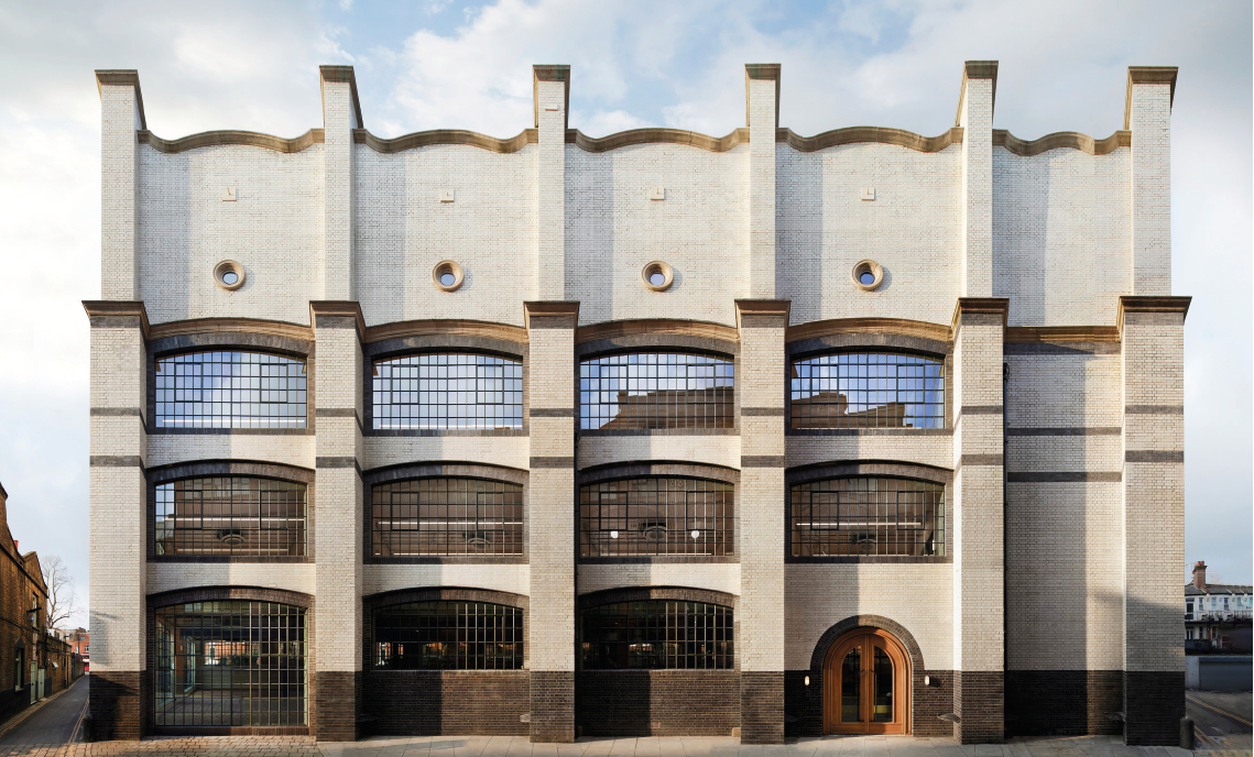 Extensive facade refurbishment to Voysey House includes the white glazed brickwork. 