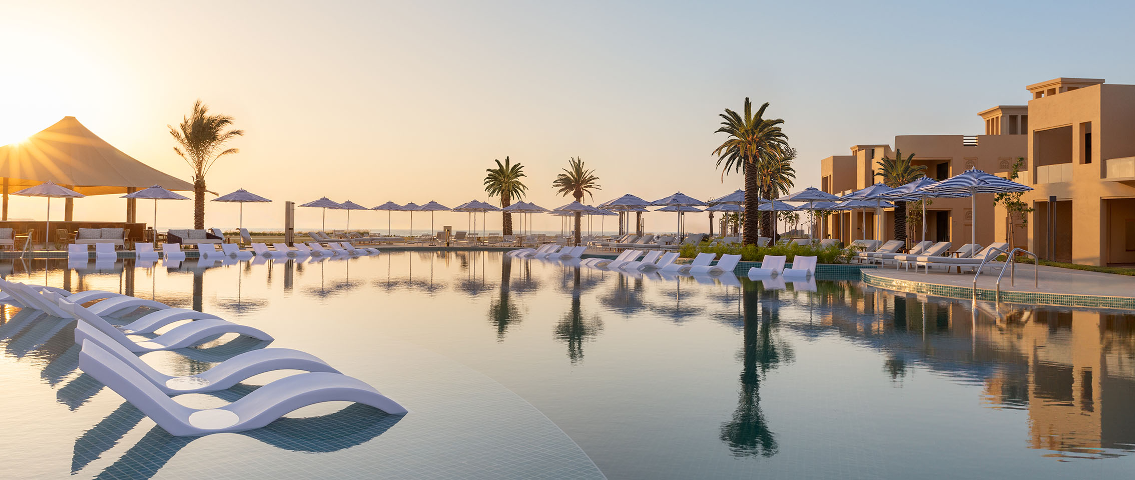 Beachfront swimming pools overlooking the azure waters of the Gulf
